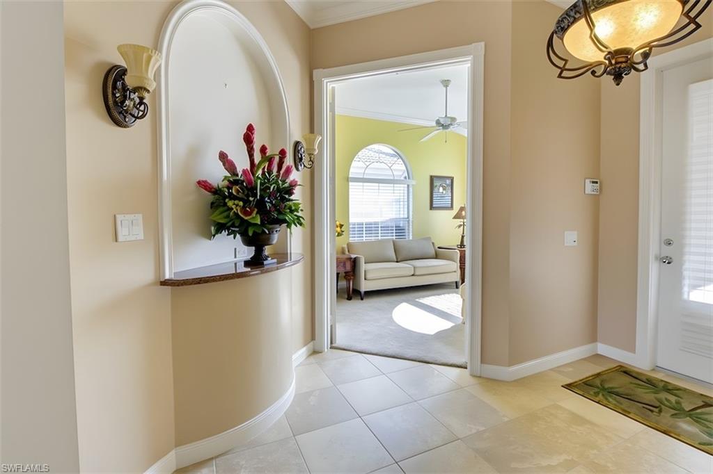Entryway featuring ornamental molding, access to the Den/Office and Great Room