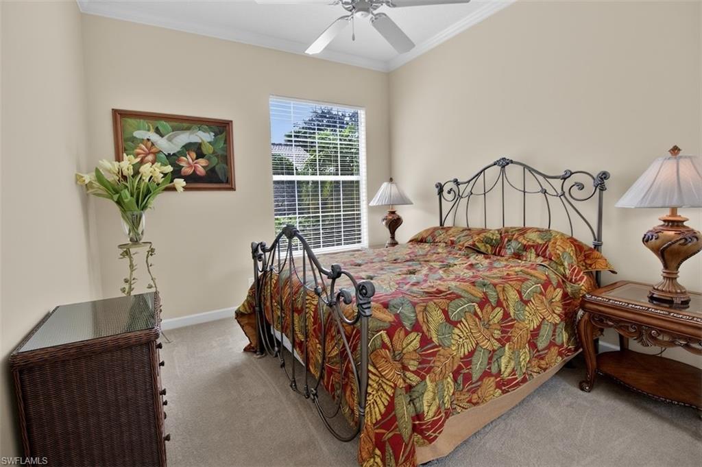 Bedroom #3 featuring crown molding, light colored carpet, and ceiling fan