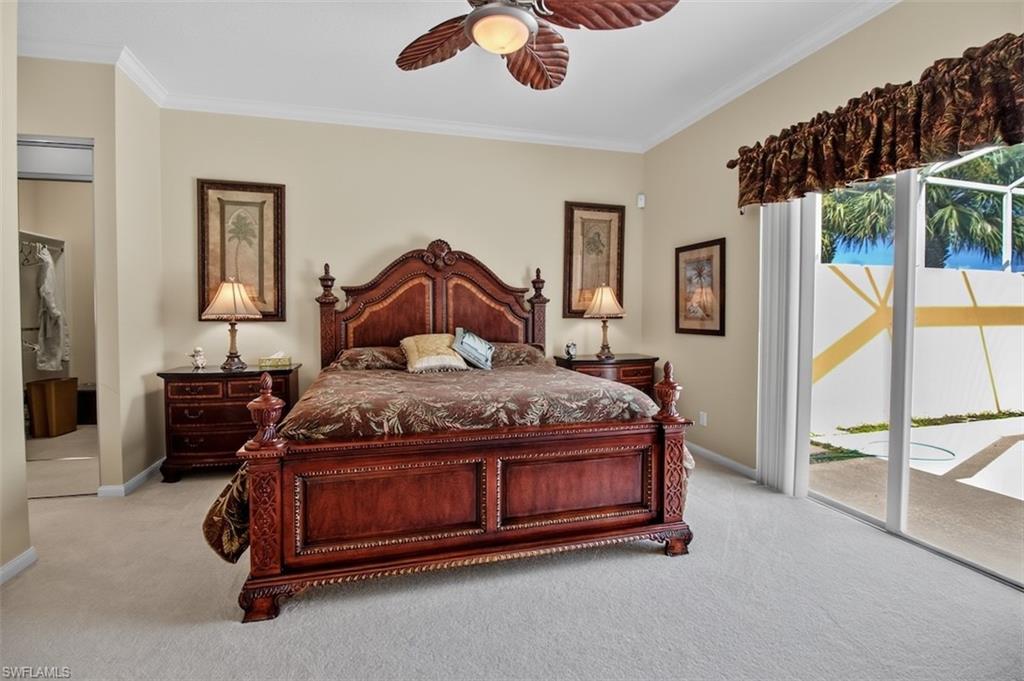 Bedroom featuring access to outside, ornamental molding, light colored carpet, and ceiling fan