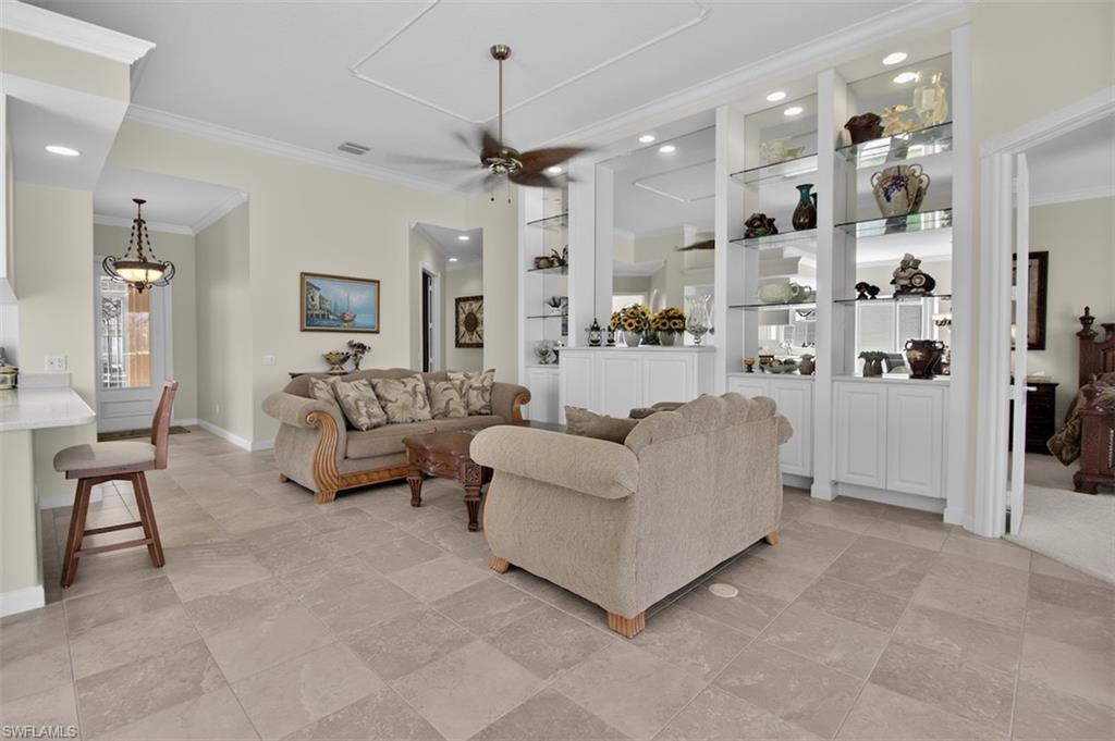 Living area with built in wall/shelves unit