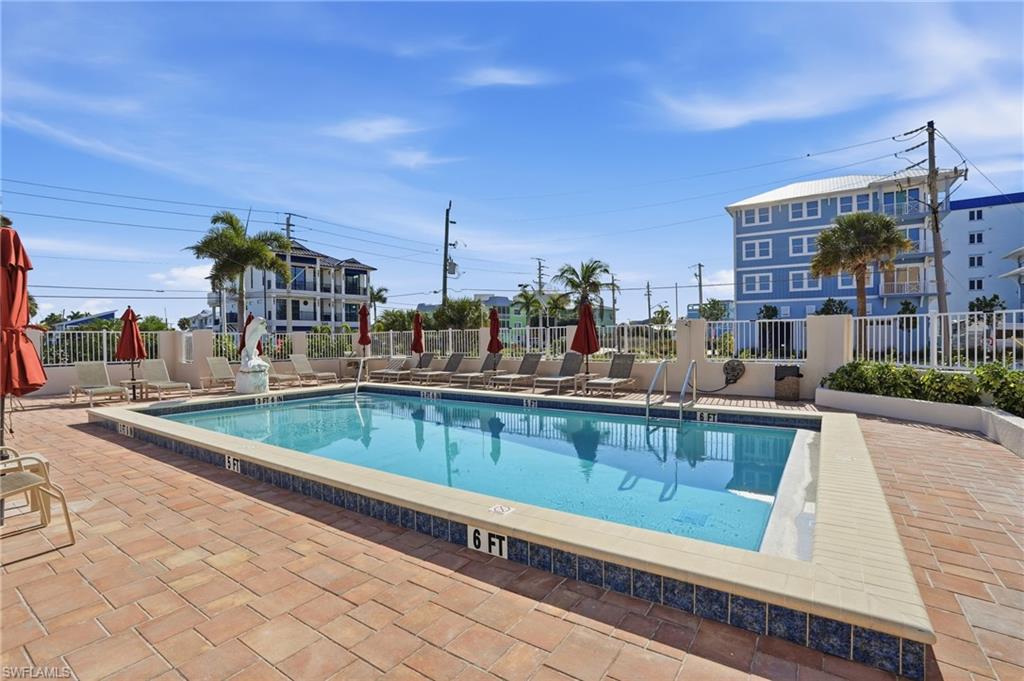 Community pool featuring a patio - Virtually Edited Image