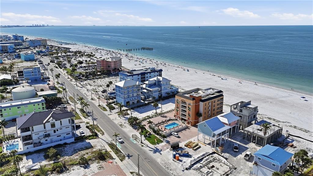 View of urban area featuring waterfront with a beach - Virtually Edited Image