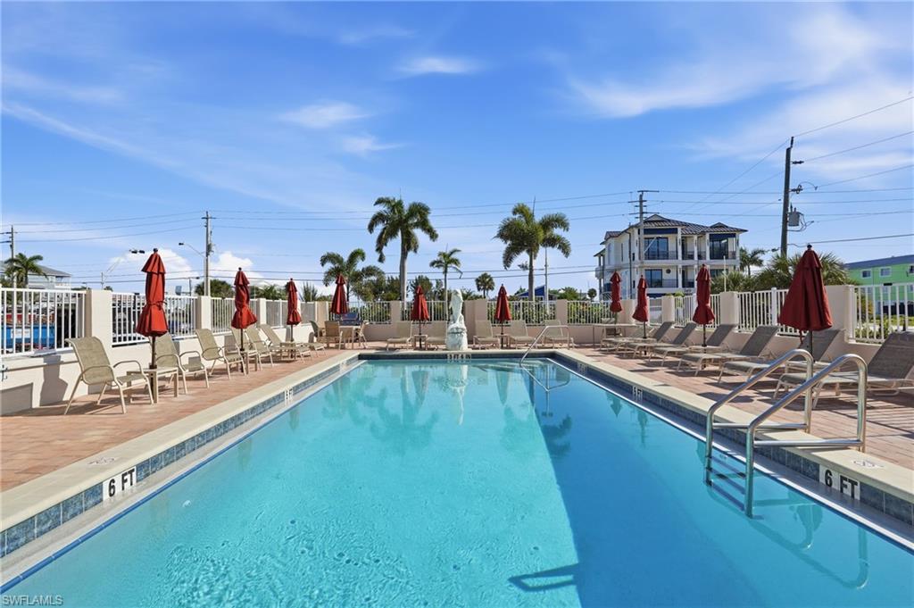 Community pool featuring a patio - Virtually Edited Image