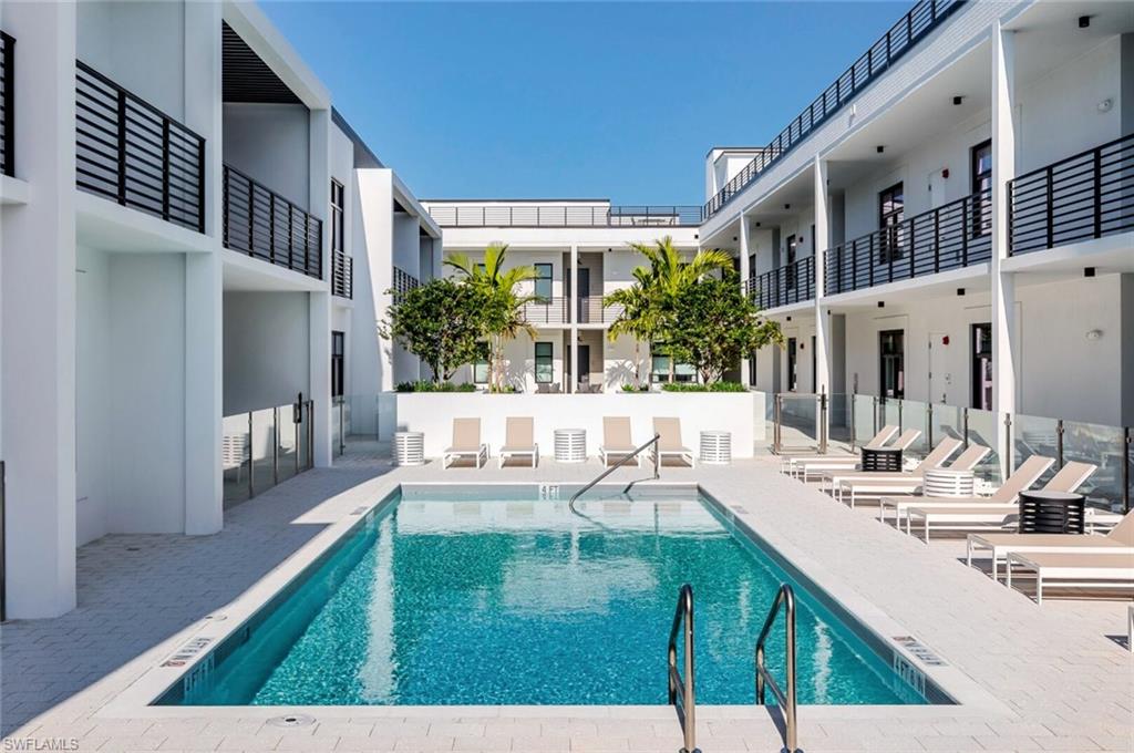 Community pool with a patio