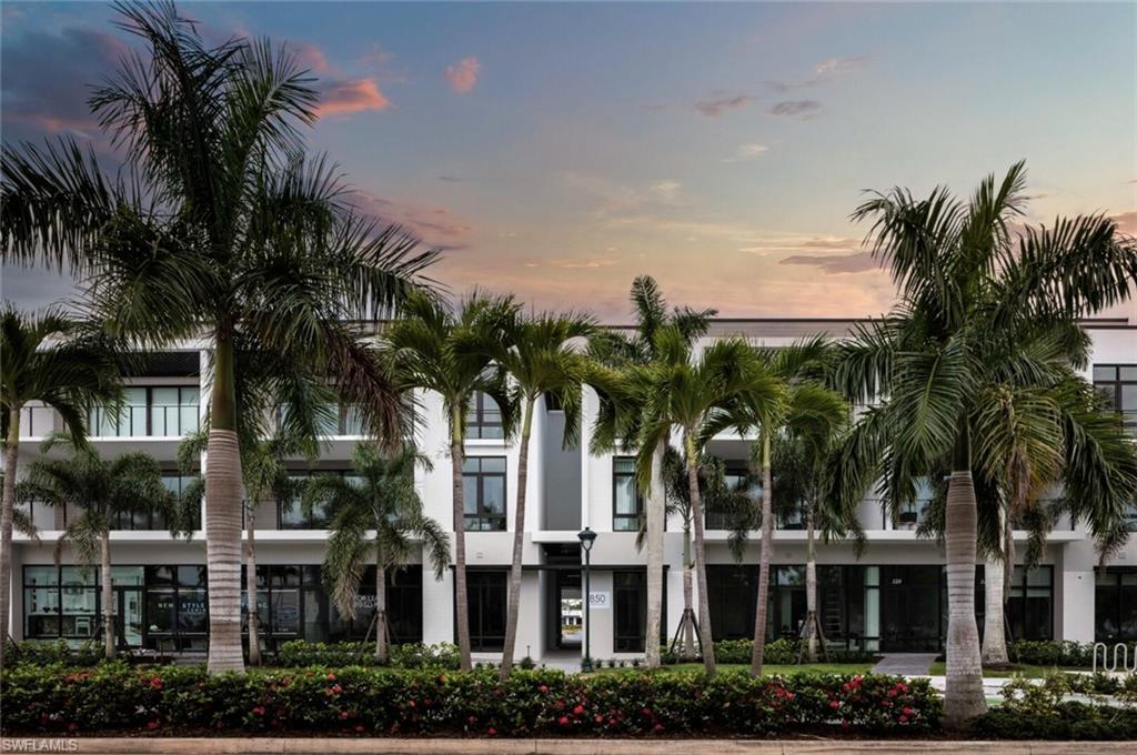 View of property at dusk