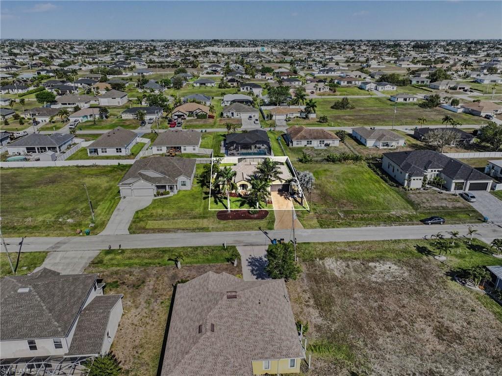 View of property location with nearby suburban area