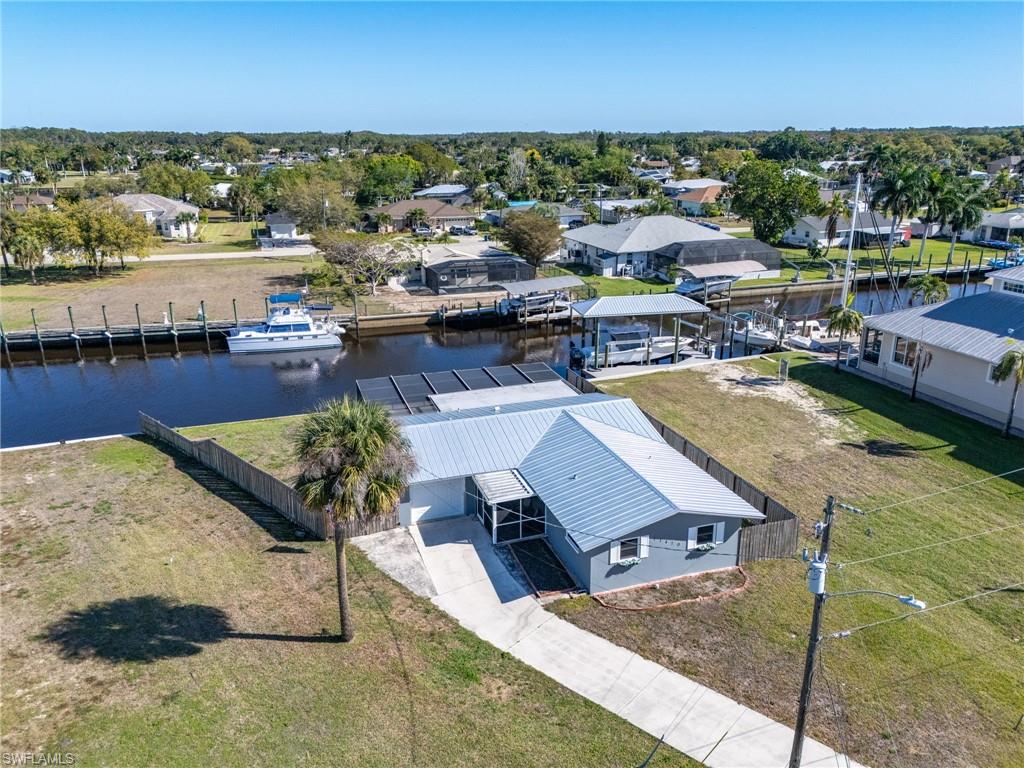 Aerial view of residential area featuring a large body of water