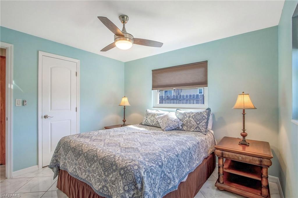 Bedroom featuring baseboards and ceiling fan