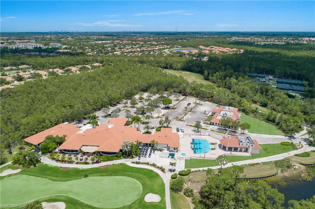 Bird's eye view with view of golf course and a water view