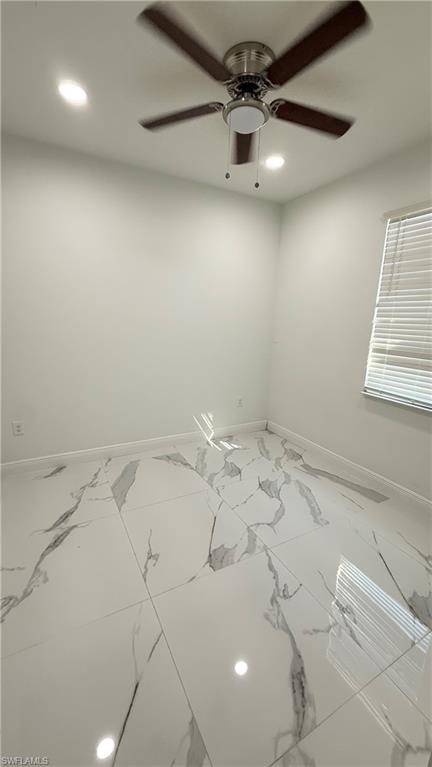 Unfurnished room featuring recessed lighting, ceiling fan, and marble look tile flooring