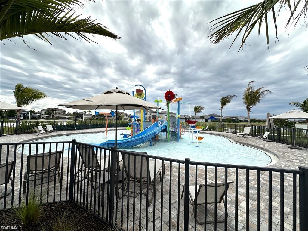 View of splash pad with a patio