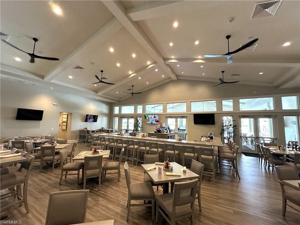 In door dining area at the club house, featuring recessed lighting, and plenty of natural light, Bar with seating