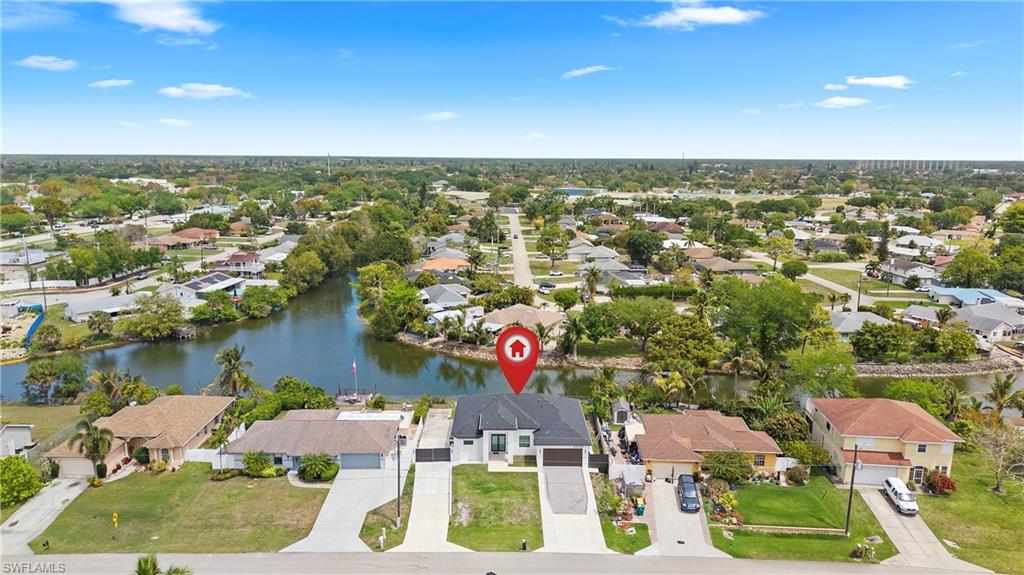 Aerial perspective of suburban area with a large body of water