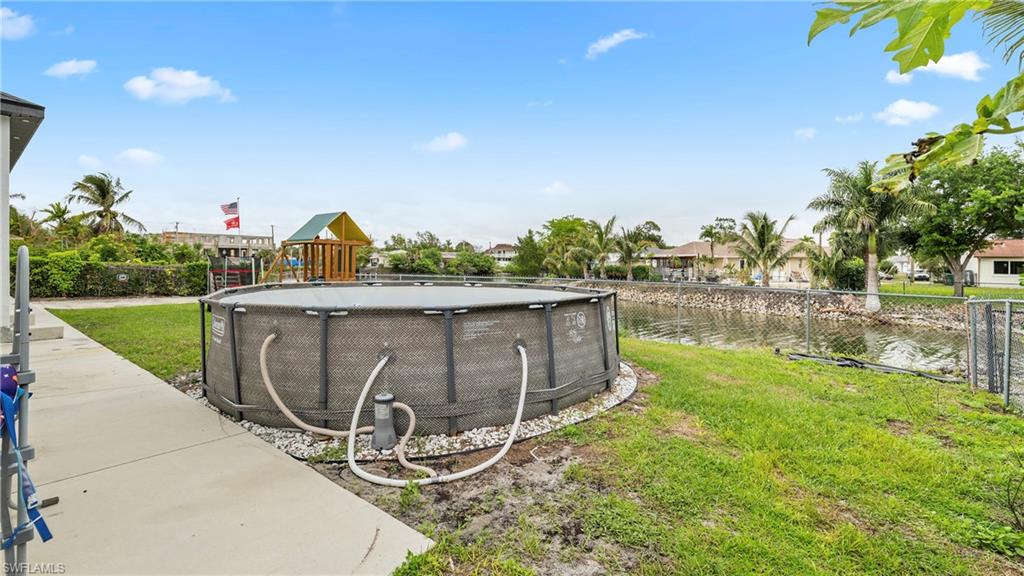 Fenced yard with a water view