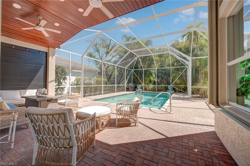 Outdoor pool with a patio area, a screen enclosure