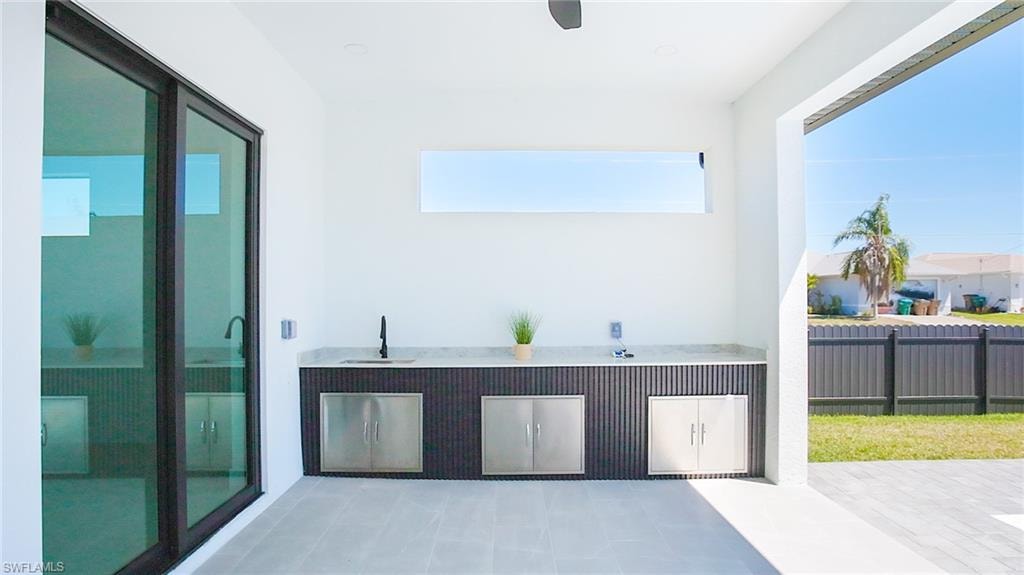 Enjoy your LANAI & PRIVATE POOL AREA w/ dedicated EXPANSIVE COUNTERTOP SPACE w/ 3 STORAGE AREAS & COMMERCIAL-GRADE SINK, perfect for alfresco dining & entertaining year-round.