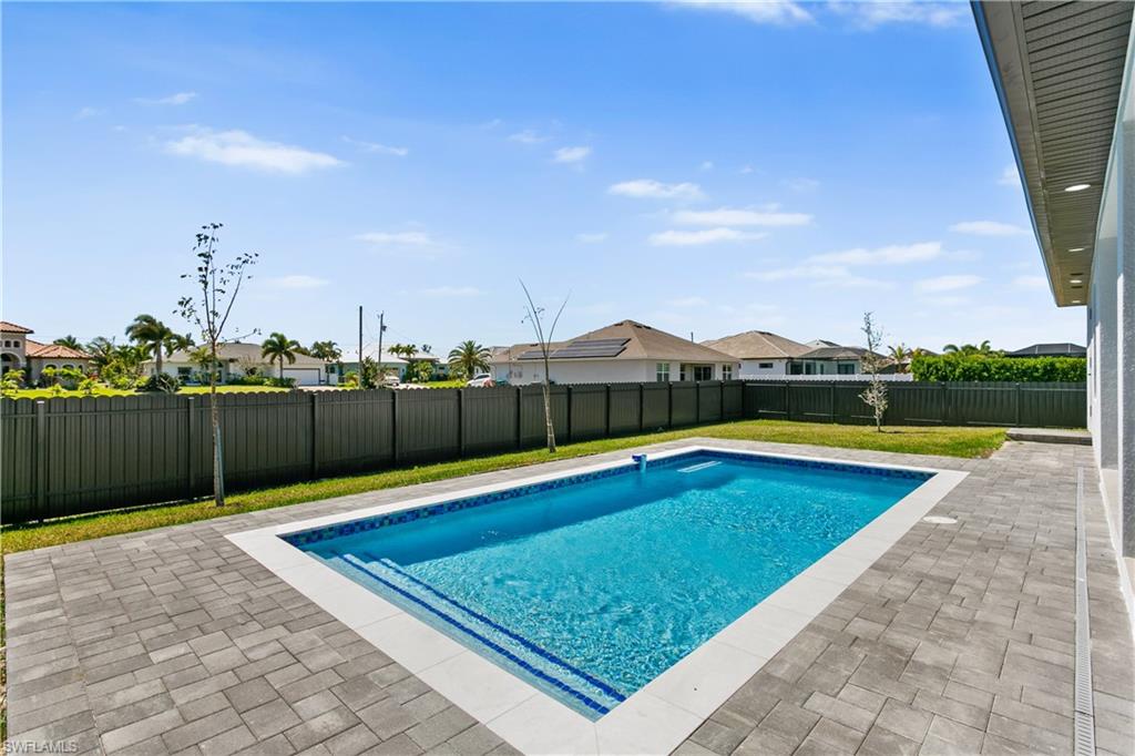 Enjoy a beautifully designed pool area perfect for relaxing or entertaining year-round.