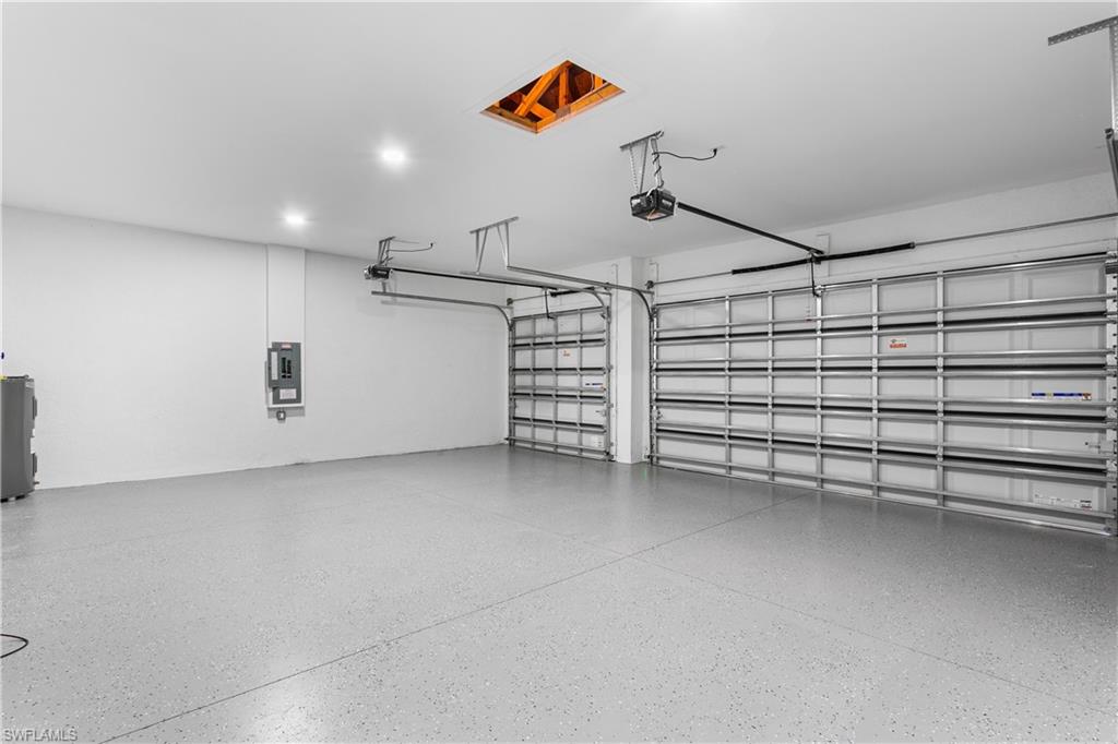 Spacious 3-car garage offers ample room for vehicles, storage, and all your Florida lifestyle toys.