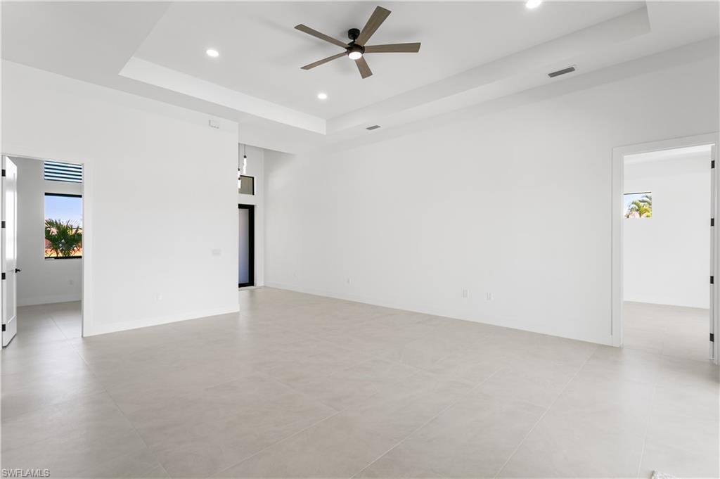 Step into an IMPRESSIVE FOYER leading to a SPACIOUS LIVING ROOM w/ soaring 16-ft COVE CEILINGS, ideal for entertaining.