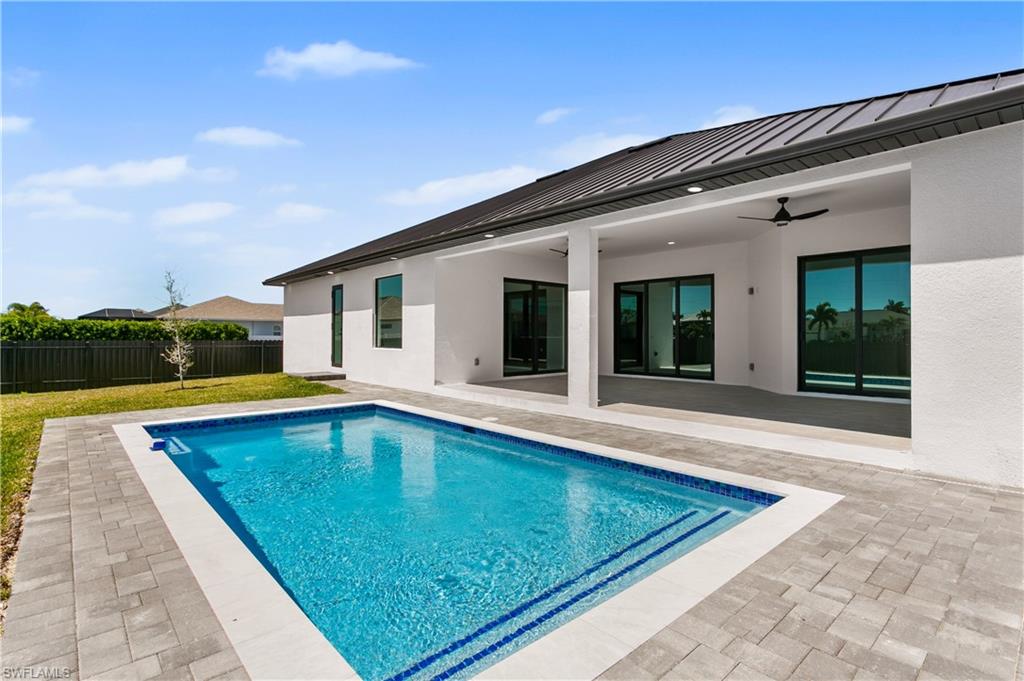 Sparkling pool invites you to cool off and unwind while enjoying the serene outdoor setting
