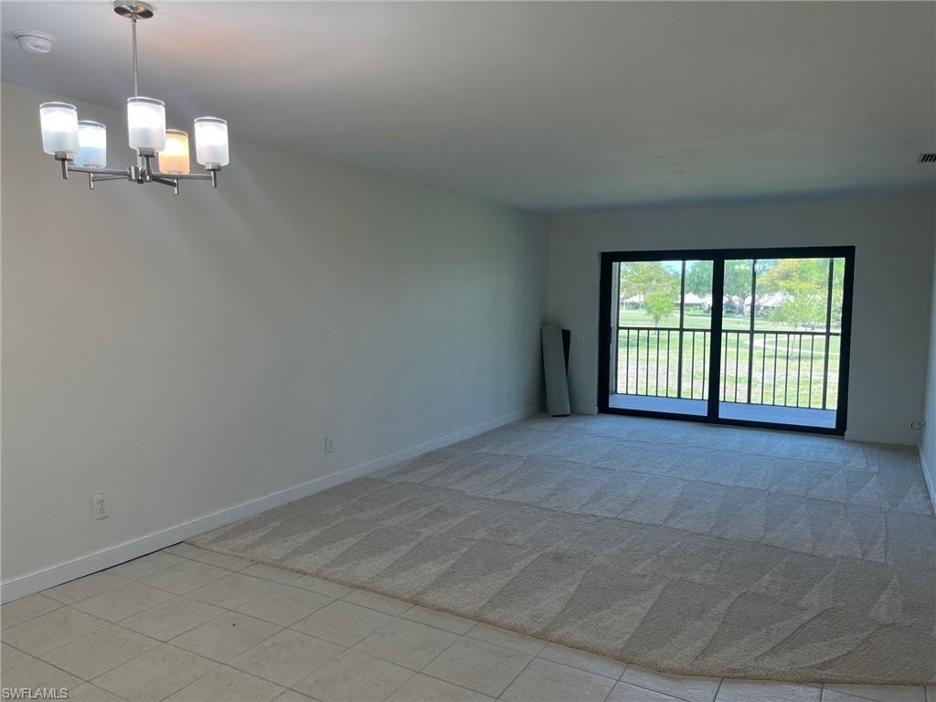 Living and Dining Room with Impact Resistant Doors to the Screened in Lanai