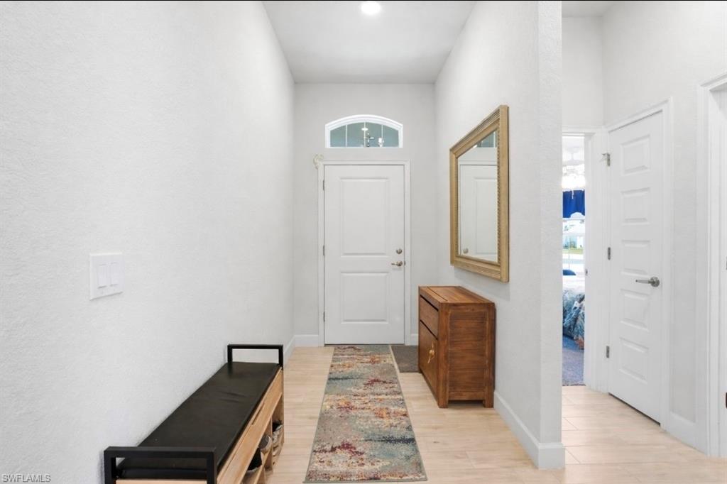 Bathroom featuring light wood-style flooring and baseboards