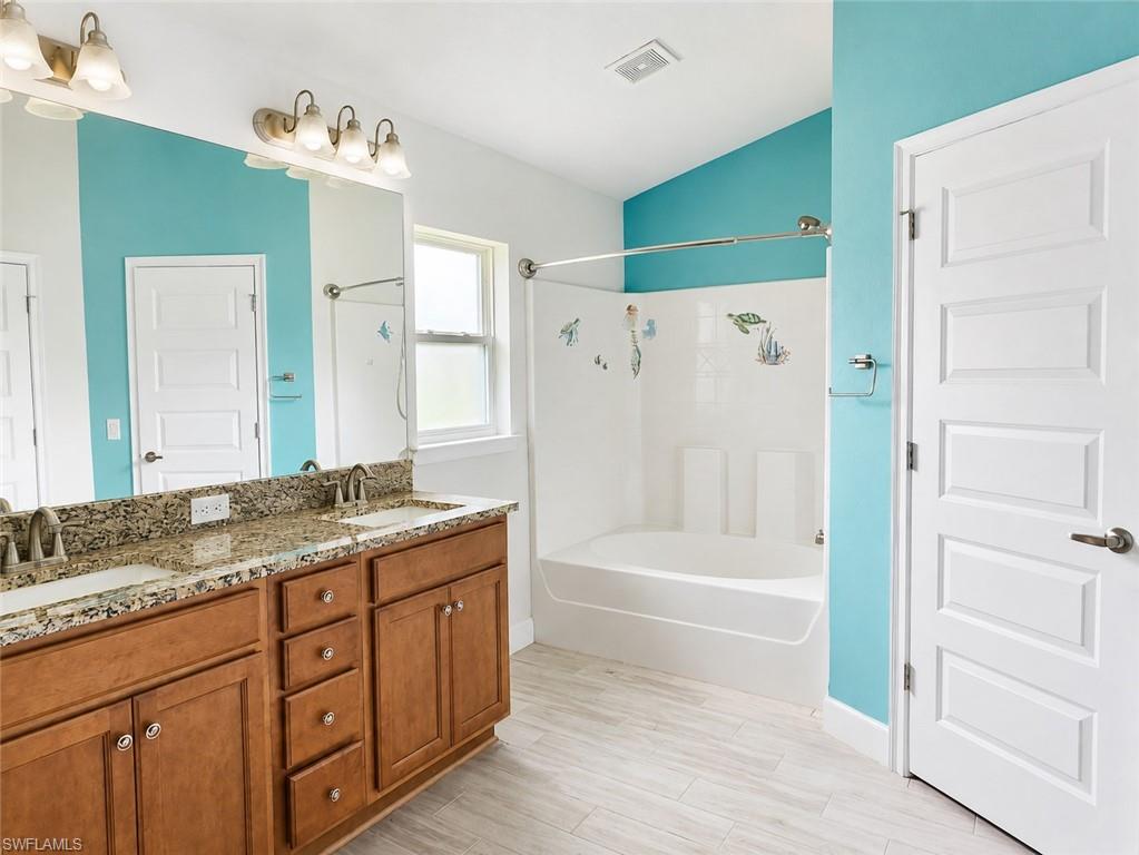 VIRTUALLY STAGED Foyer featuring light wood finished floors and baseboards