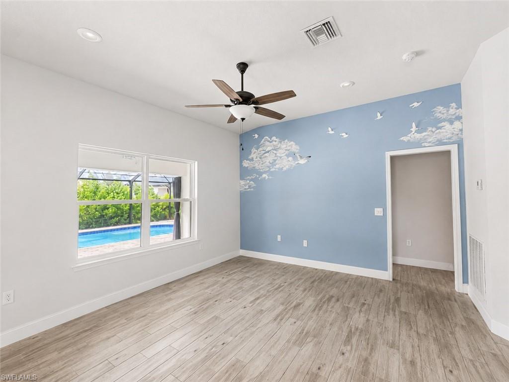 Outdoor pool with a sunroom, a lanai, and a patio area