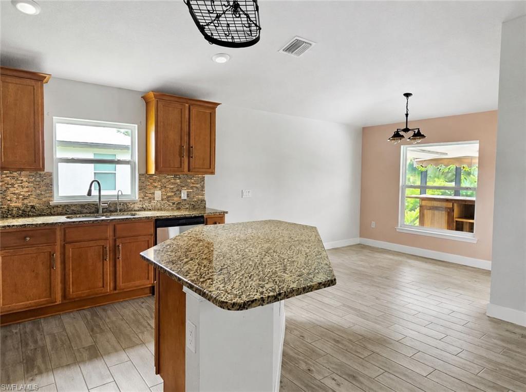 Living area featuring recessed lighting and a ceiling fan
