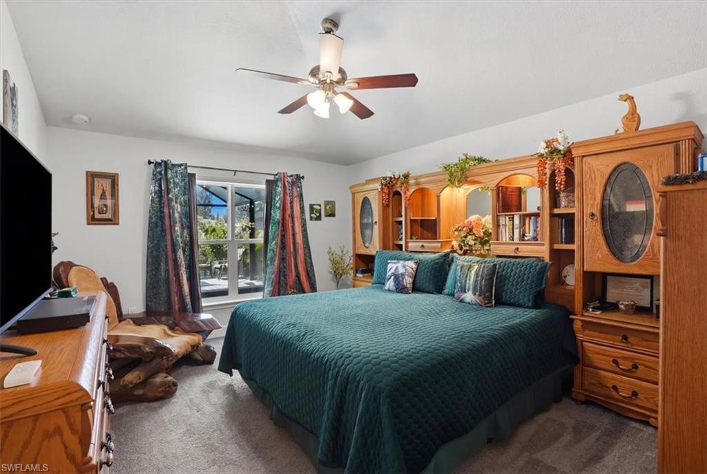 Living area with ceiling fan, light wood-style flooring, and recessed lighting
