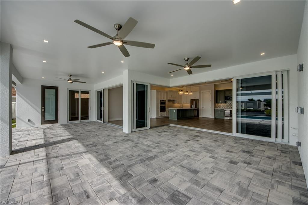 Patio with outdoor kitchen. Example of similar home.