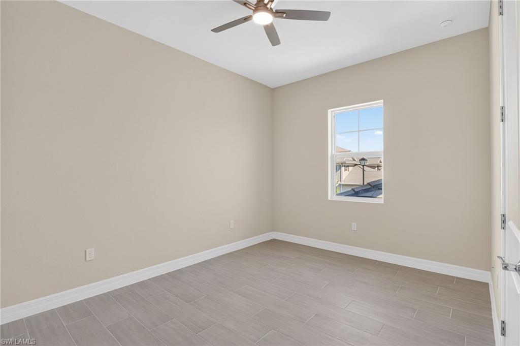 Spare room featuring ceiling fan and wood finish floors