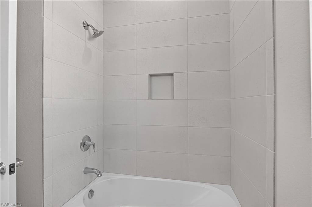 Full bathroom with bathing tub / shower combination
