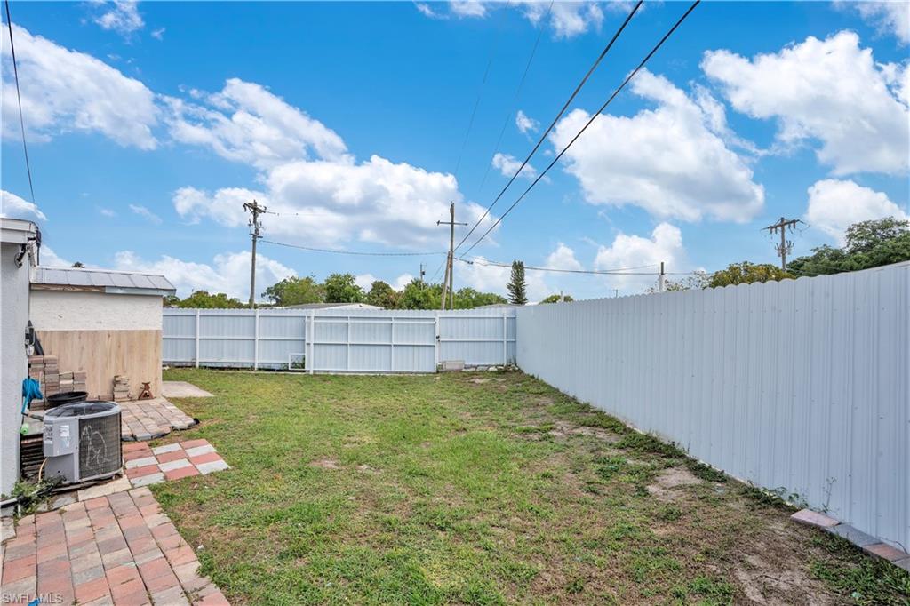 Fenced backyard featuring a patio