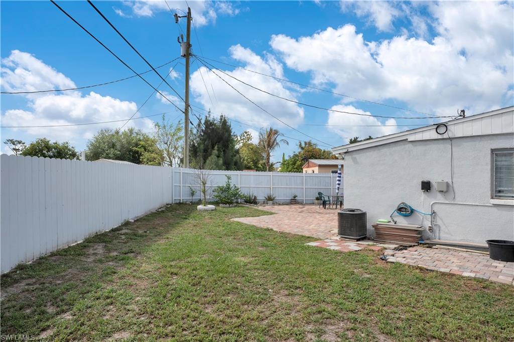 Fenced backyard with a patio area