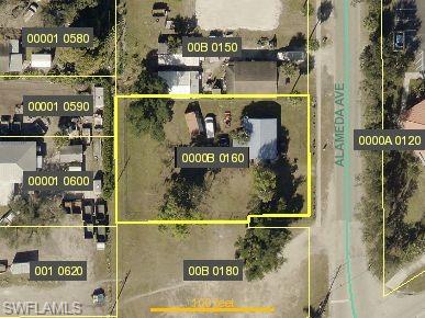 Aerial map of property and surrounding area featuring property parcel outlined