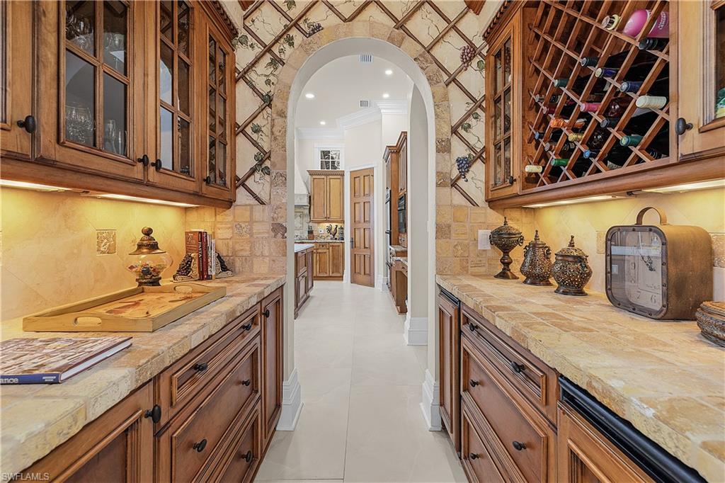 Butler pantry with large wine cabinet.