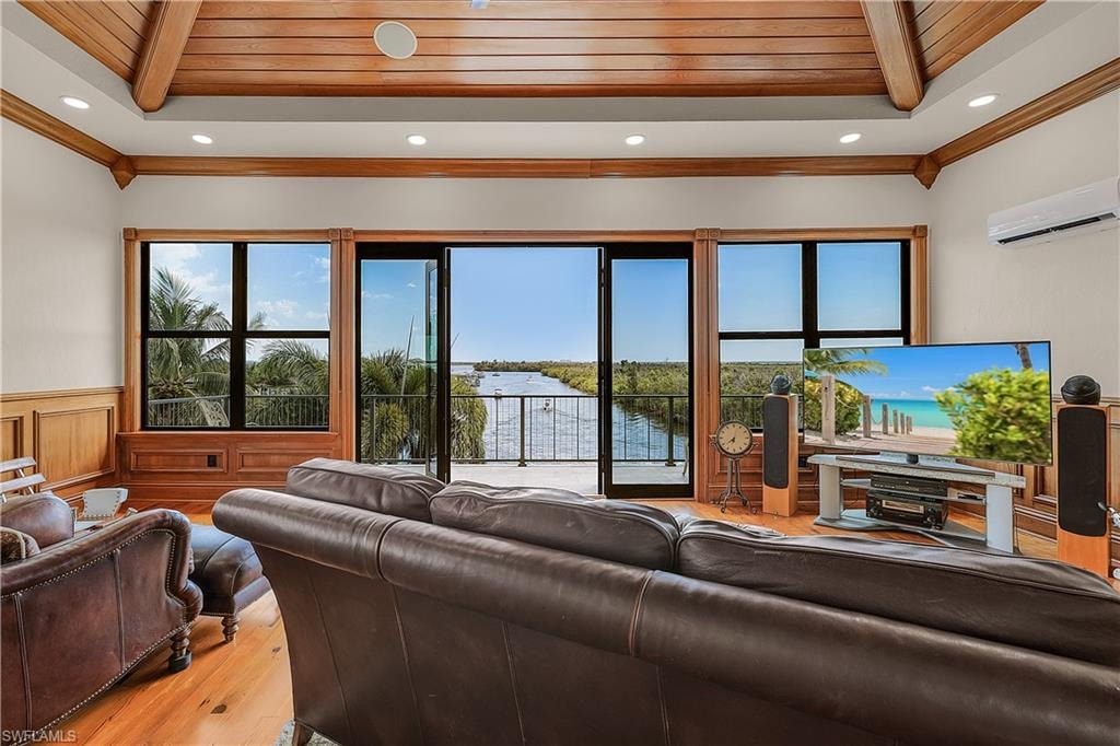 Third floor bonus room with full bathroom, private balcony, and wet bar. Looking down the main canal to the Caloosahatchee River with views all the way to Sanibel Island.