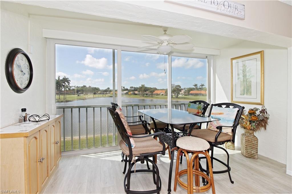 Open and airy sun room with long view of lake