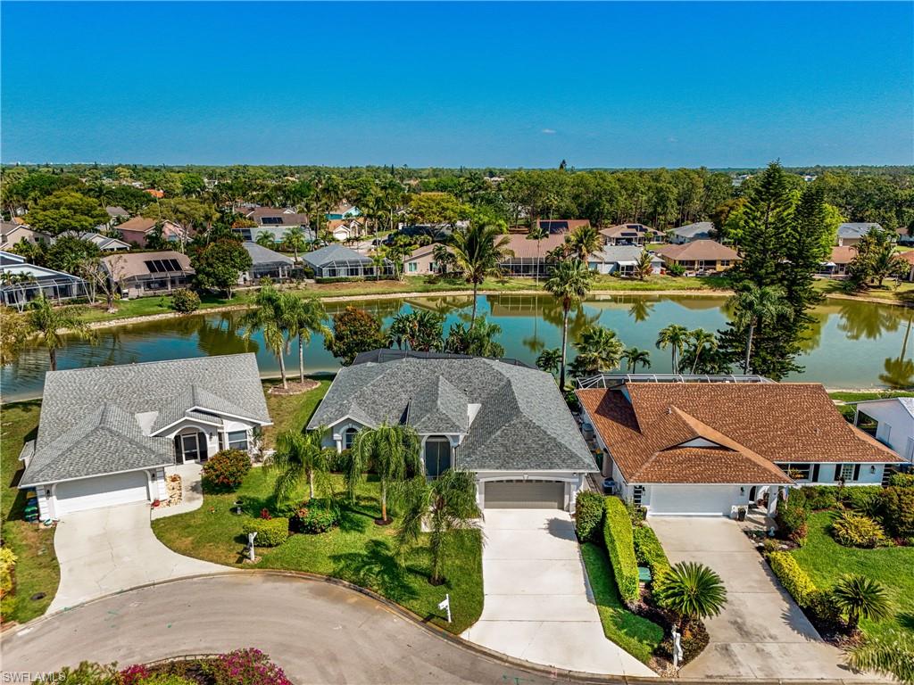 Aerial view of residential area with a nearby body of water