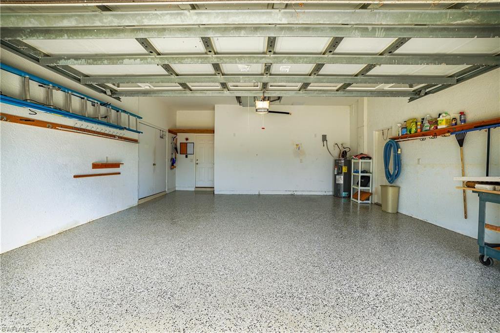 Garage featuring electric water heater