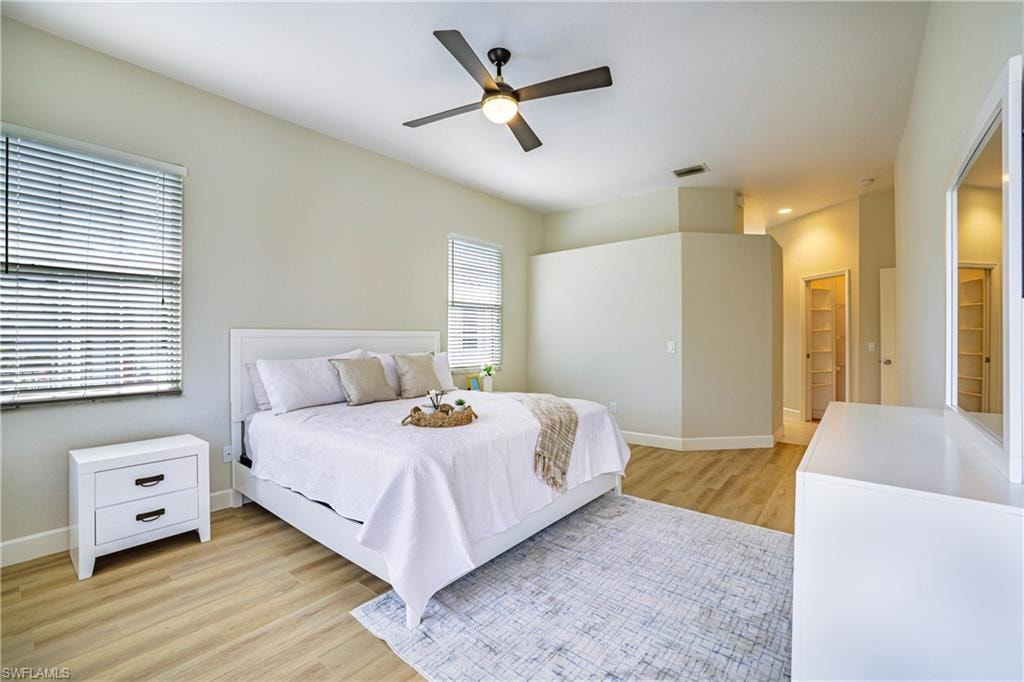 Bedroom featuring light wood-style floors and a ceiling fan