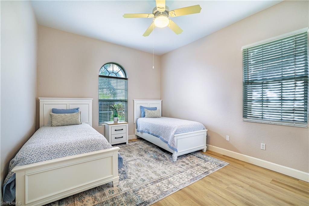 Bedroom featuring ceiling fan and wood finished floors