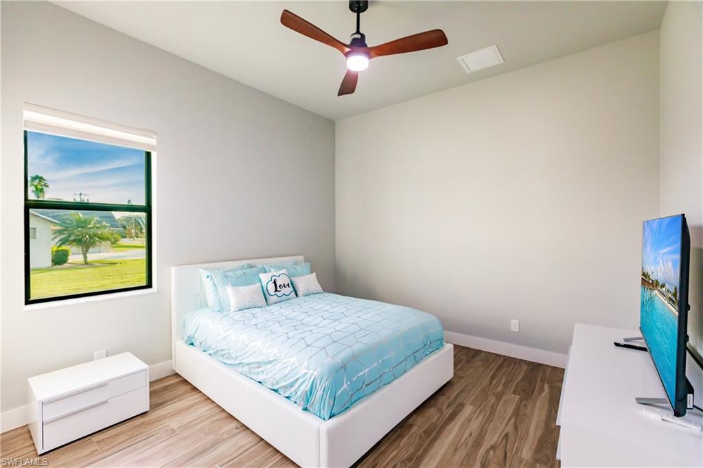 Bedroom featuring wood finished floors and a ceiling fan