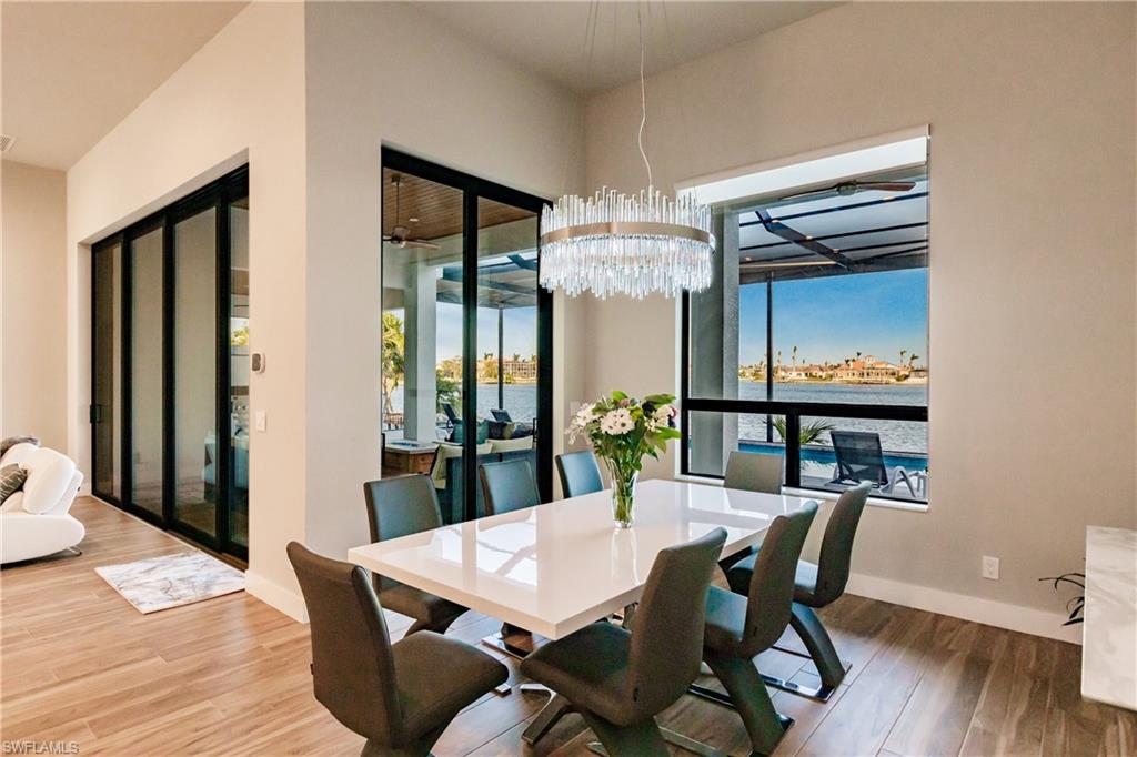 Dining room featuring wood finished floors and a chandelier