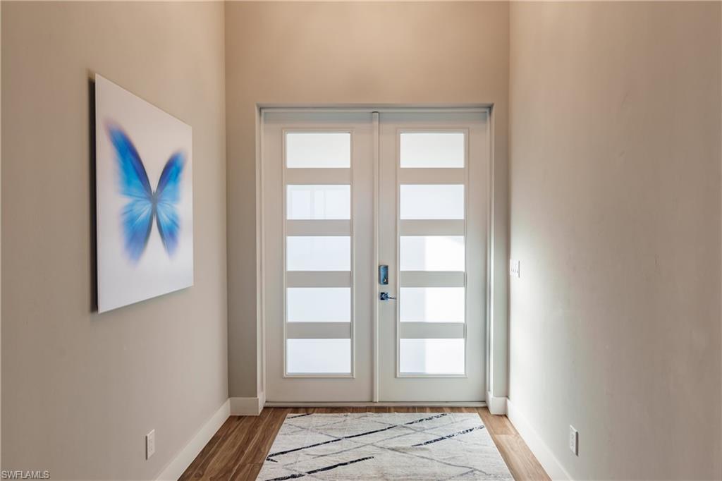 Foyer featuring baseboards and light wood-type flooring