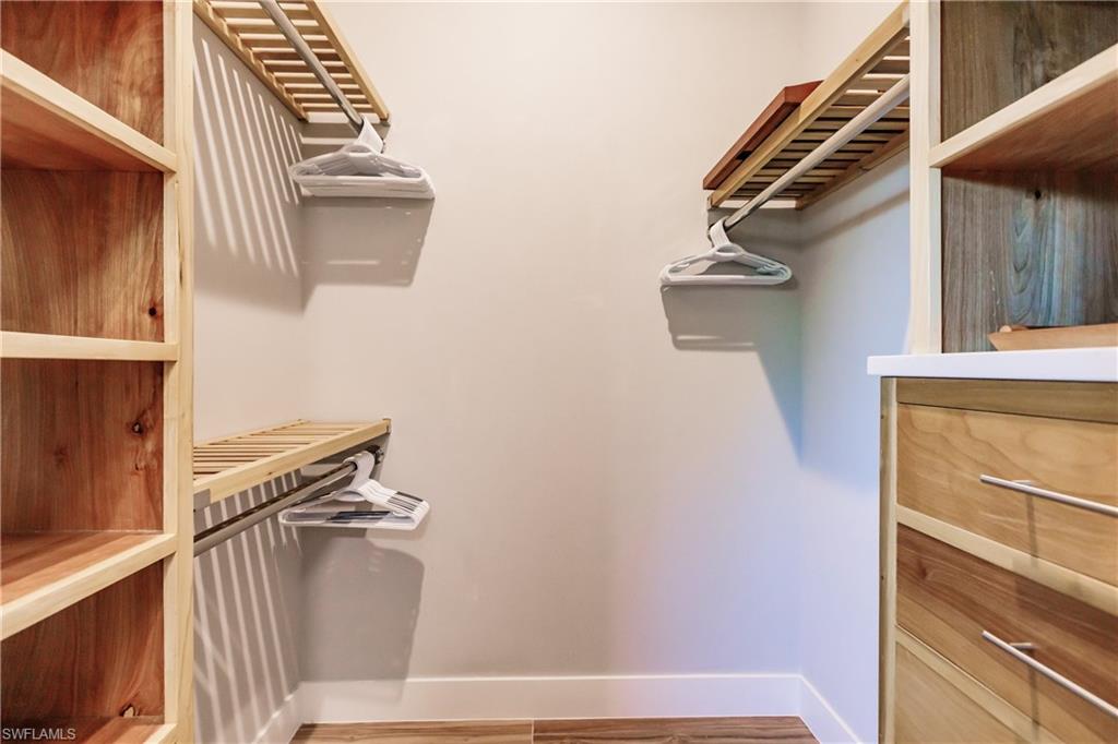 Spacious closet featuring wood finished floors