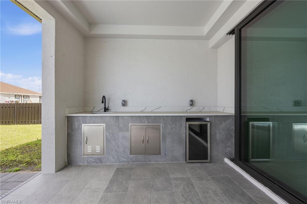 View of patio / terrace with exterior kitchen and wine cooler