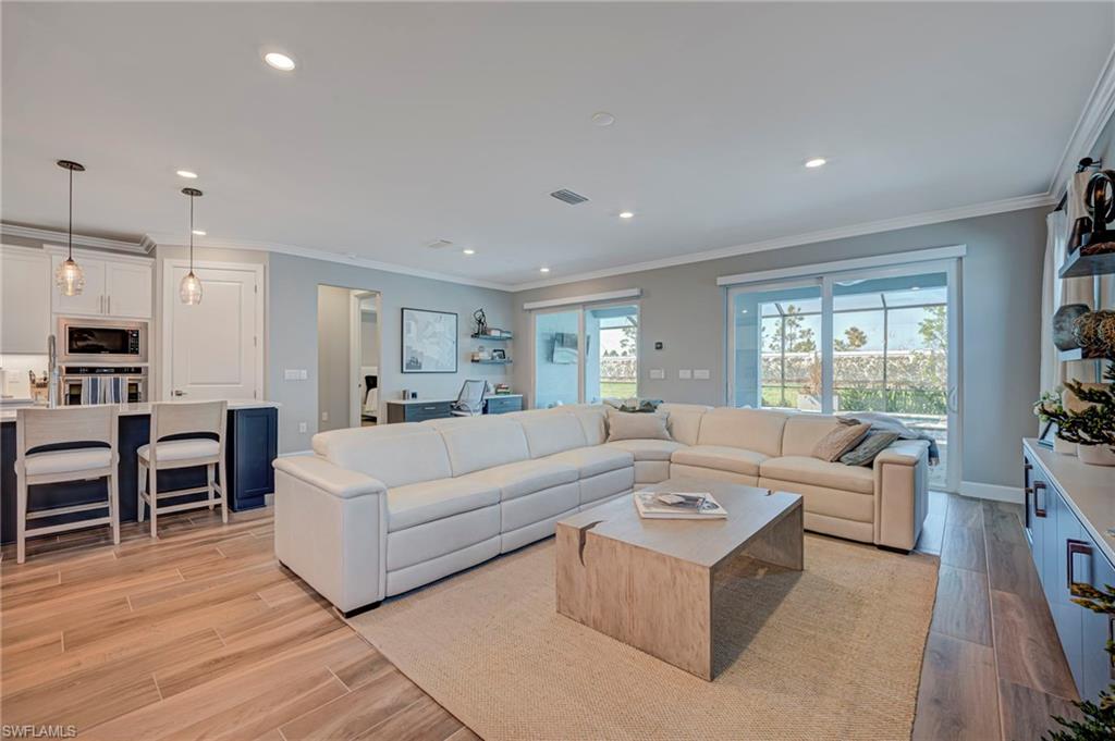 Spacious living room with built in desk on the back wall