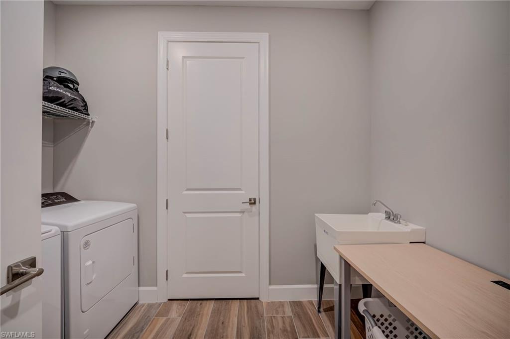 Great size laundry room with utility sink